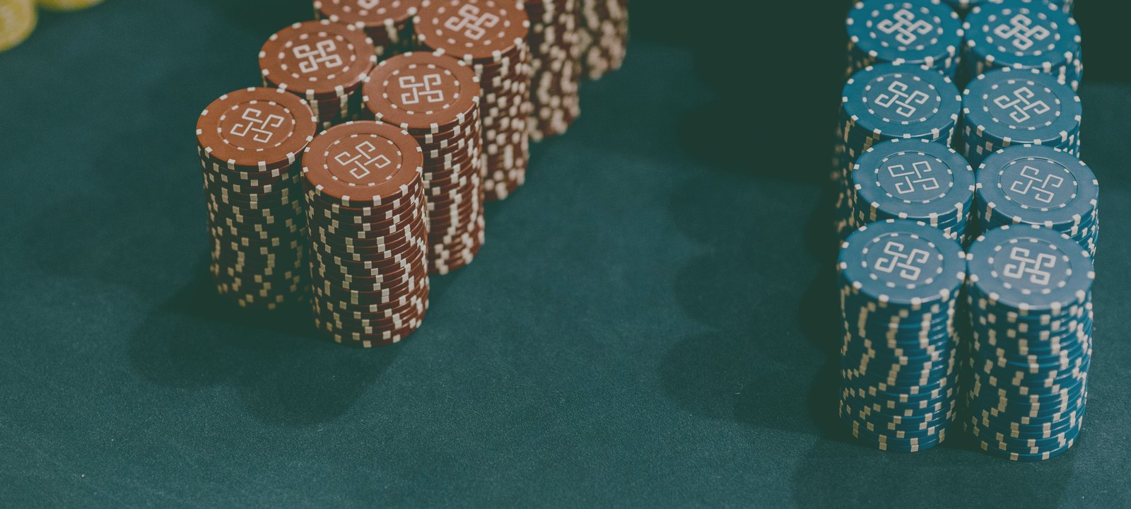 Dark poker chips, jade-graded